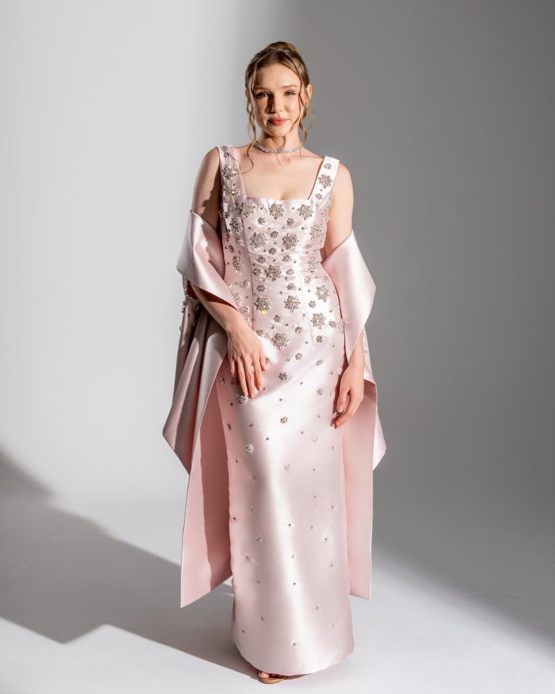 Evening gown in pink satin with crystal embroidery, hard light on the cyclorama
